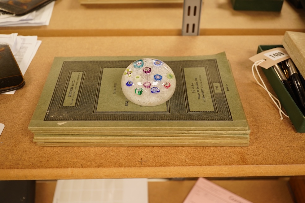 A Perthshire millefiori paperweight, 6.5cm in diameter, together with related Sotheby’s catalogues
